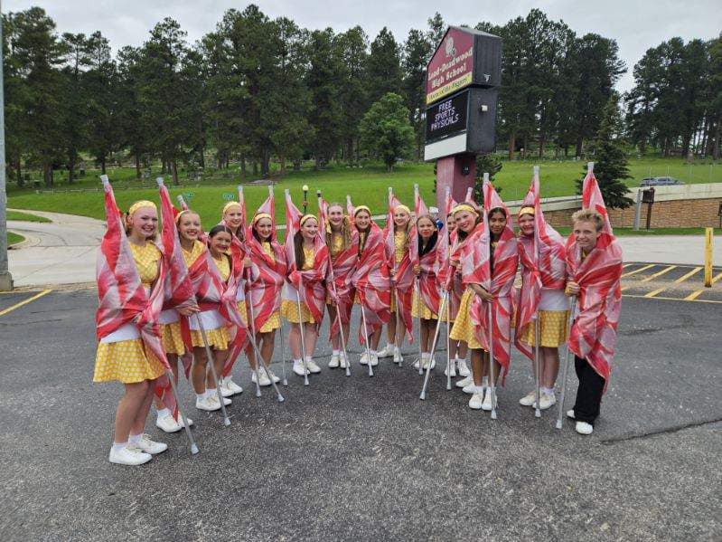 Colorguard is staying warm before marching