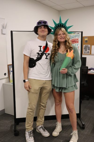 Tyler Sturm and Lili Herber as an NYC tourist and Lady Liberty