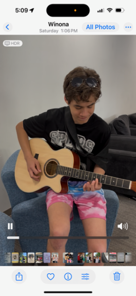 Diego Ayala playing his guitar in the dorm on May 24. 