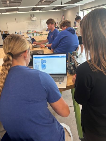 Savannah Repinski and Brooklyn Staudacher program robots in Mr. Paulsen's engineering class