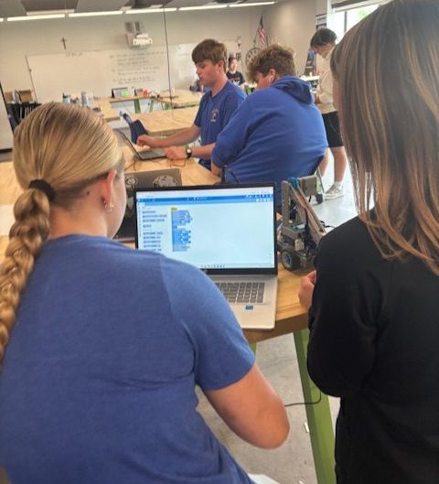Savannah Repinski and Brooklyn Staudacher program robots in Mr. Paulsen's engineering class
